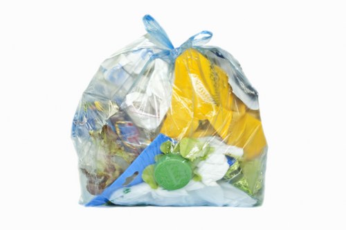 Company van and team preparing for commercial waste collection in Weybridge